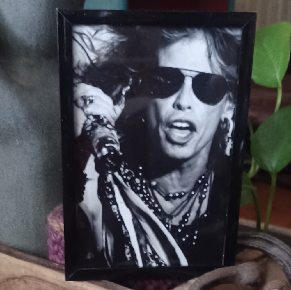 Black Framed Photo of Music Icon